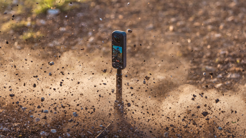 360 action camera standing in rugged terrain as dirt and debris fly through an extreme outdoor scene | Altitude Philippines