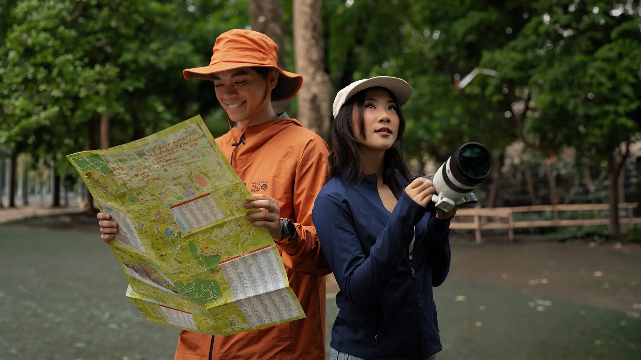 Outdoor explorers using a map and camera while navigating a forest trail | Altitude Philippines