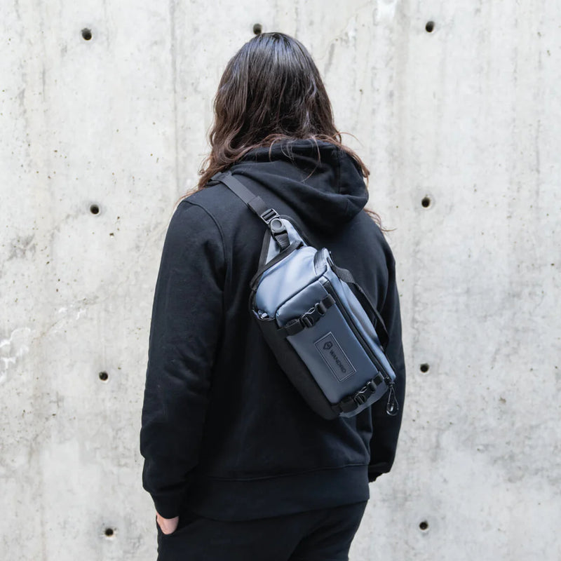 Girl using Wandrd Rogue Sling 6L Bag