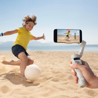 DJI Osmo Mobile 7 being used for photography at the beach