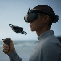 Person flying a DJI drone using the DJI Goggles 3