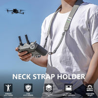 Person holding a drone's remote while using the new STARTRC Lanyard