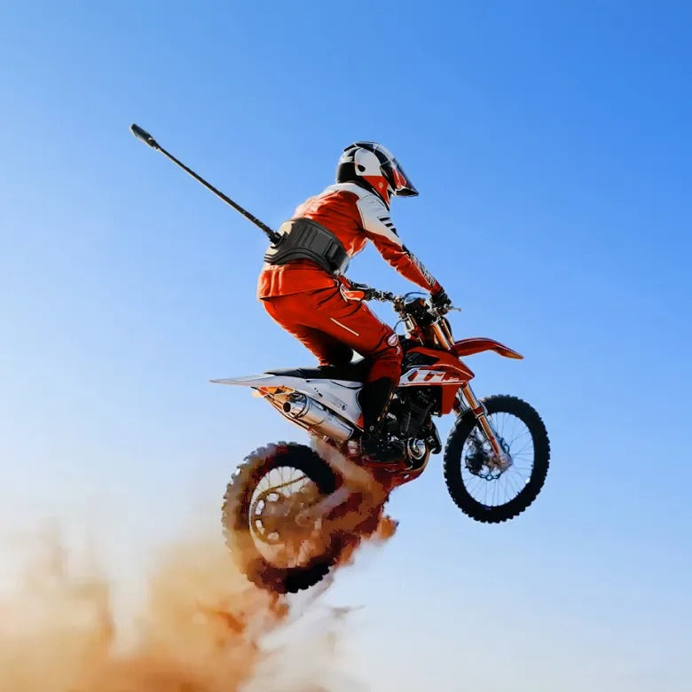 Guy on dirt bike wearing Insta360 Enhanced Waist Strap for hands-free action footage