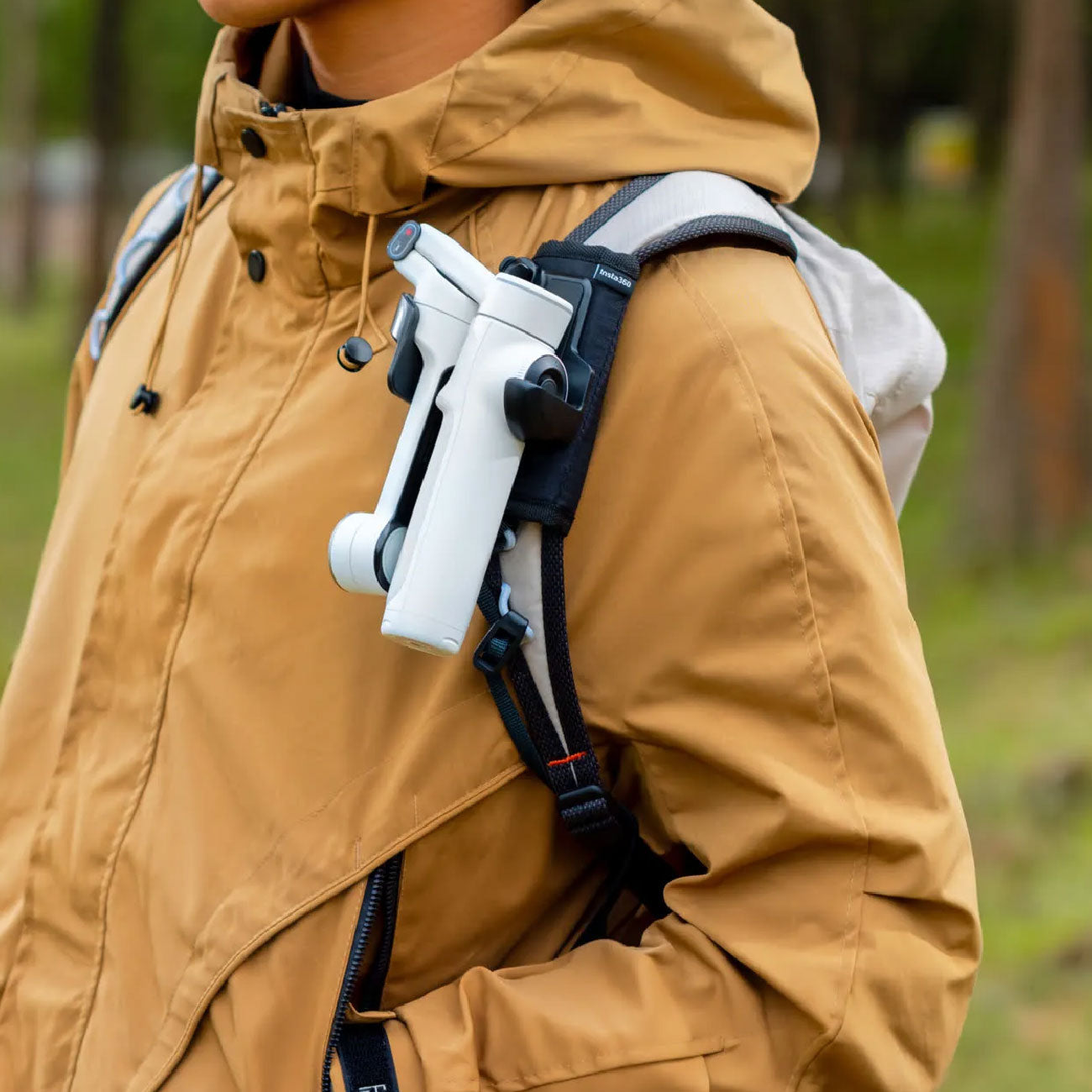 Guy using the Insta360 Flow 2 Pro mounted on his backpack