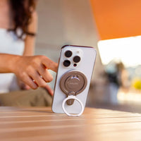 Girl using the Insta360 Flow 2 Pro mount as a phone stand