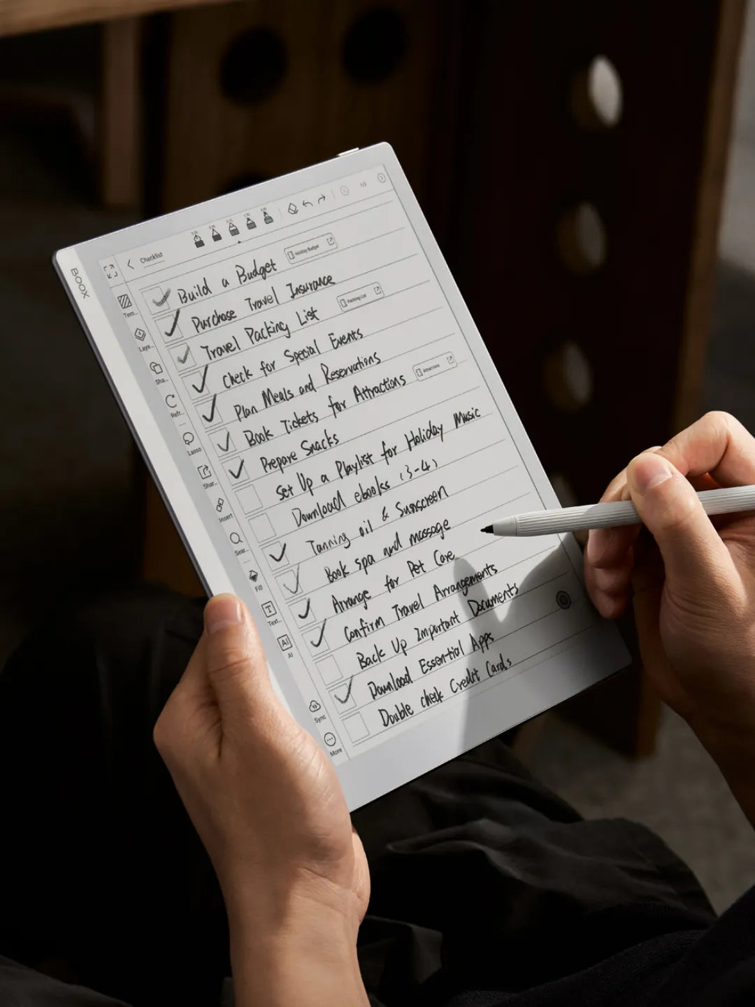 Person holding an e-notebook with a pen displaying a digital to-do list | Altitude Philippines