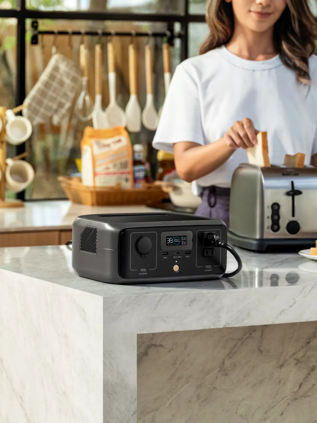 Person using a portable power station to power a toaster in a kitchen | Altitude Philippines