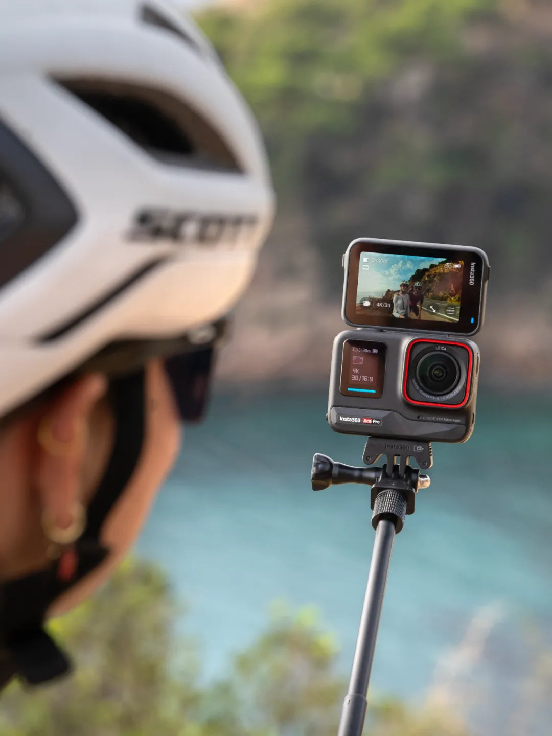 Cyclist using an action camera to vlog with a friend during an outdoor ride | Altitude Philippines