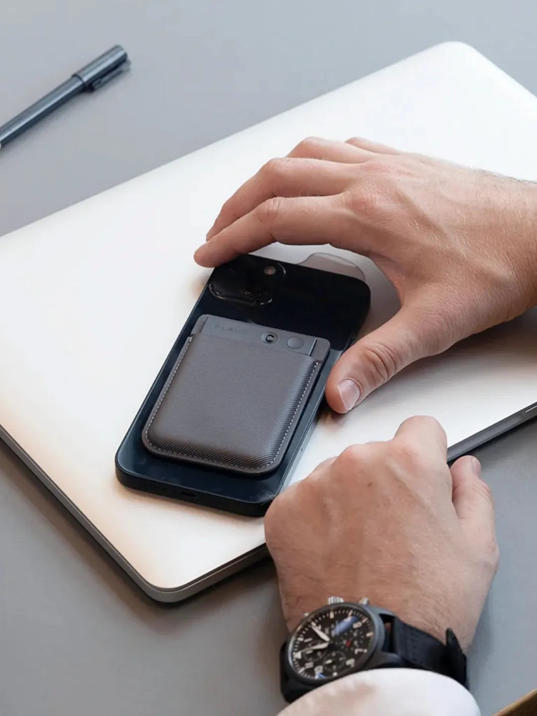 Person using smartphone with a leather smart recording device on a desk | Altitude Philippines
