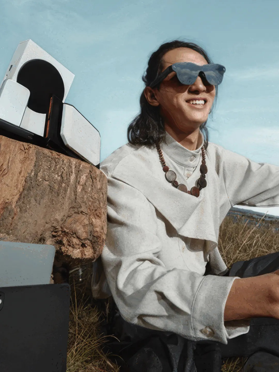 Man wearing smart sunglasses while sitting outdoors under a clear sky | Altitude Philippines