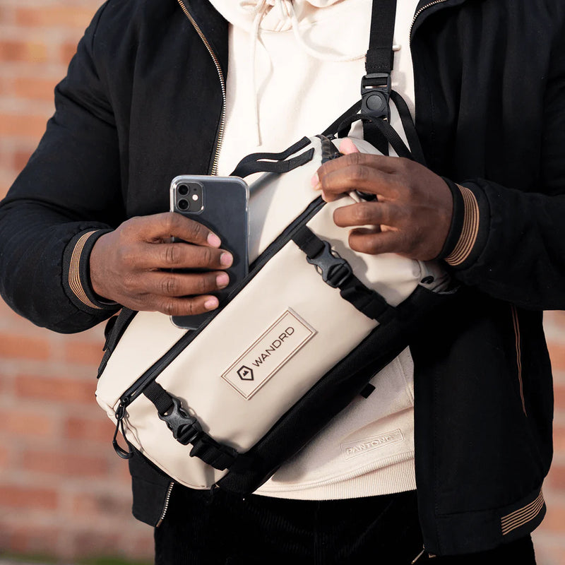 Guy using Wandrd Rogue Sling 6L Bag