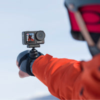 Man snowboarding using the DJI Osmo Action Wrist Strap