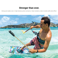 Man Holding Gold Edition Insta360 Invisible Selfie Stick while wakeboarding