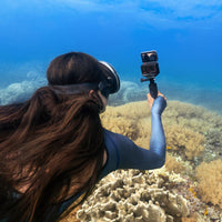 taking a selfie underwater using the Insta360 Ace Pro 2 Action Camera