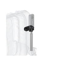 Magnetic holster holding Insta360 selfie stick on a backpack strap for hands-free filming