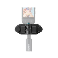 Insta360 Magnetic Selfie Stick Holster securing your camera for action shots and vlogging