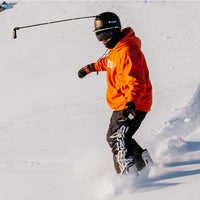 Snowboarding guy using the Insta360 Unicorn Helmet Mount