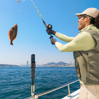 Guy fishing while filming using the Insta360 with FOMO Power Handle