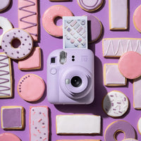 Flat lay of Instax Mini 12 Lilac Purple