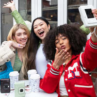 Group of friends taking a selfie using the Instax Mini LiPlay