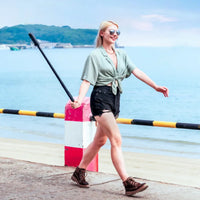 Girl taking selfie using the Insta360 Power Selfie Stick