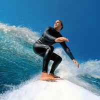 Man on a surfboard using the Insta360 Action Camera with Floating Surfboard Mount