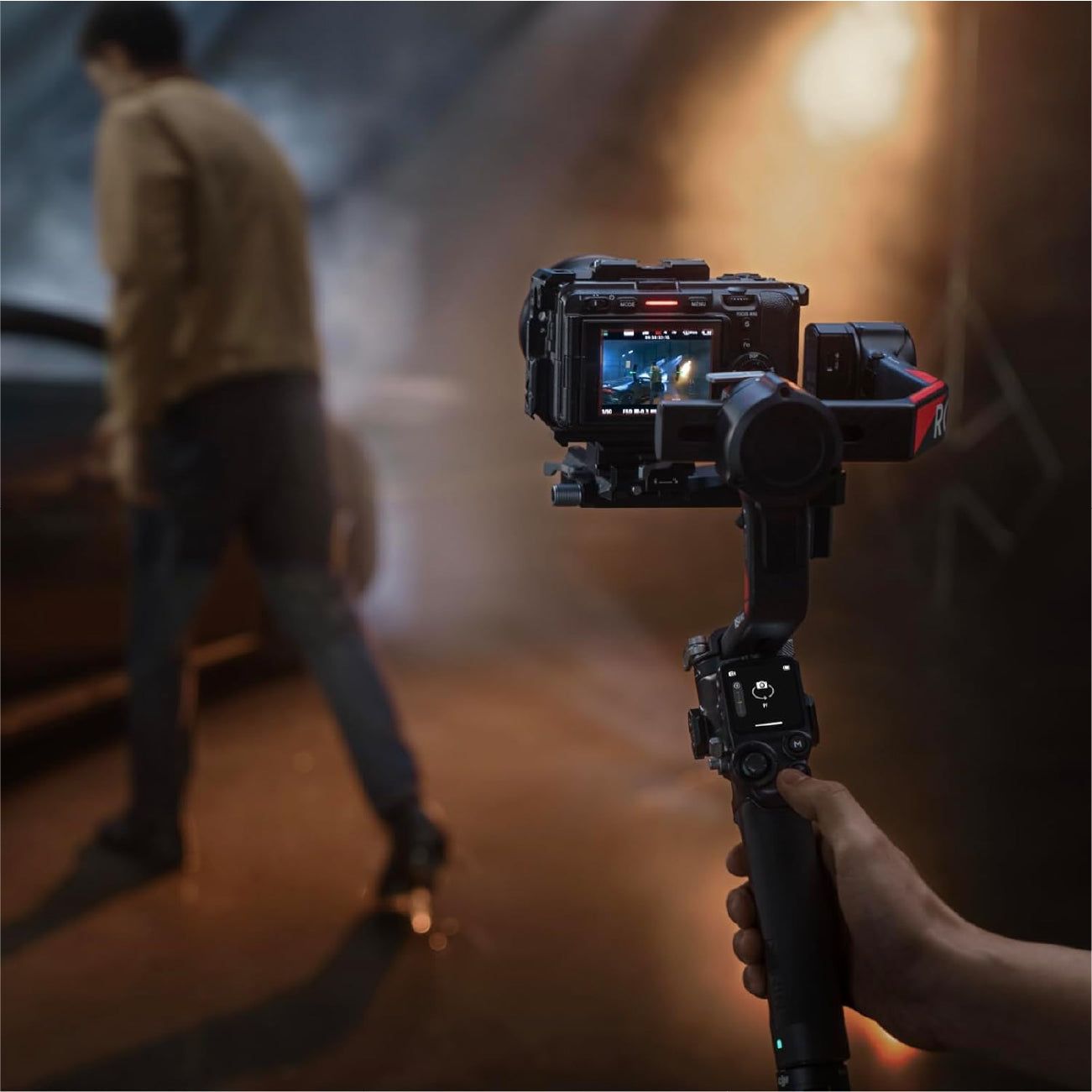 Someone taking shots on a digital camera using the DJI RS 4 Pro