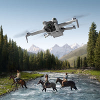 DJI Mini 4 Pro flying over 3 people on horseback