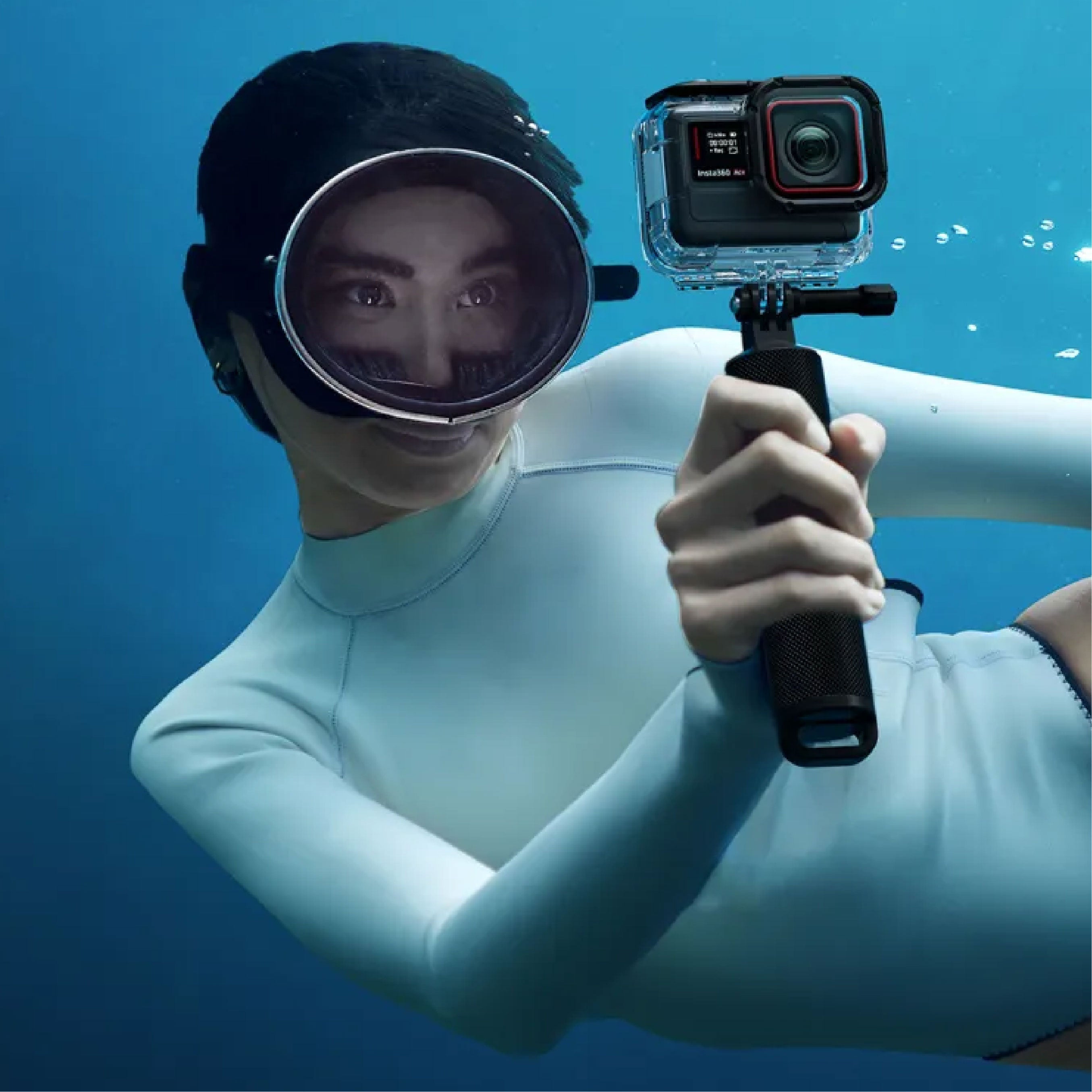 Girl freediving using the Insta360 Ace Dive Case