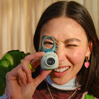 Girl using the Instax PAL Digital Camera