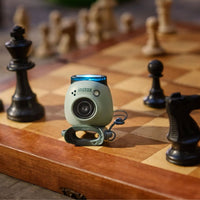 Instax PAL Digital Camera size comparison to chess piece