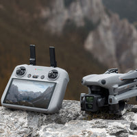 DJI Air 3 Drone and Remote on a rock