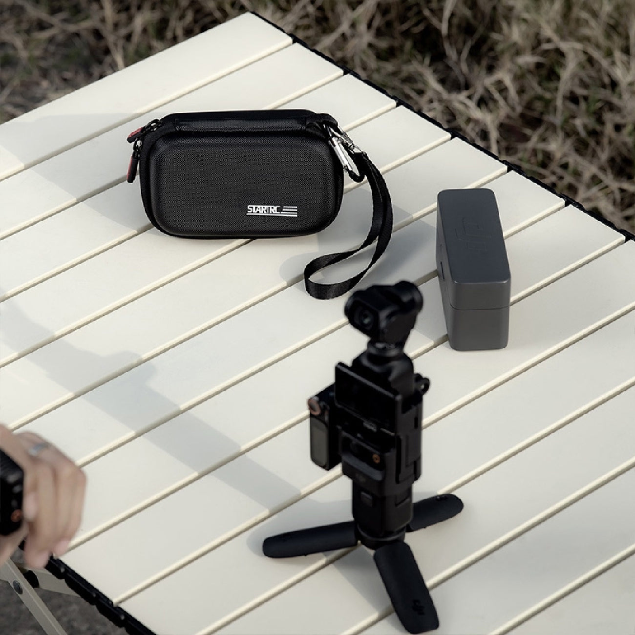 DJI MIC 2, STARTRC Carrying Bag, DJI Camera on table