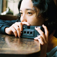 Girl holding a Kodak Reto 3D Film in Black